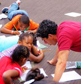 Theater Program Director Nick Anselmo works with kids in the Mantua in Action summer program